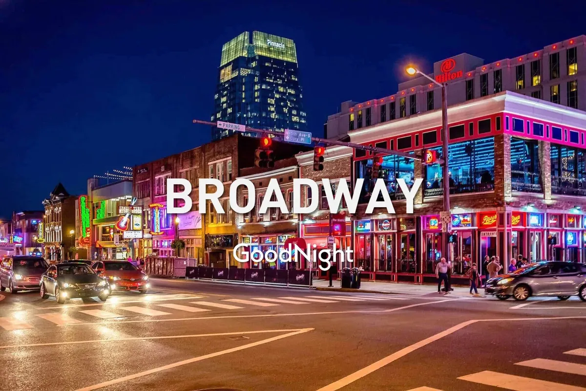 This image captures a bustling Nashville intersection at night, illuminated by vibrant neon signs and colorful buildings, with crowds of people walking and dining. The overall mood is electric and energetic, perfectly embodying the city's legendary nightlife and entertainment scene.